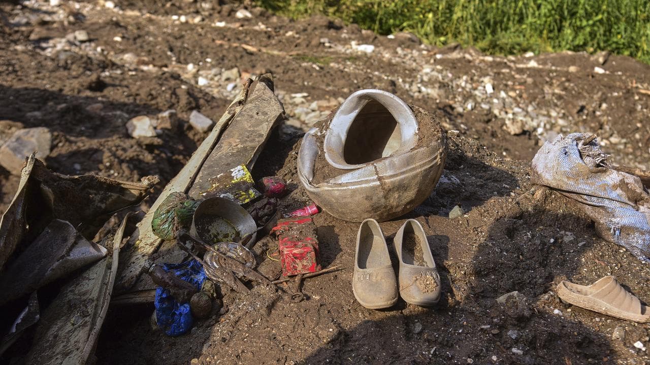 Household debris in flood mud