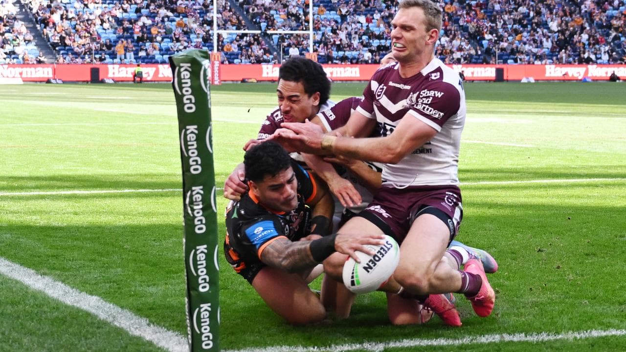 Jeral Skelton of the Tigers scores a try.