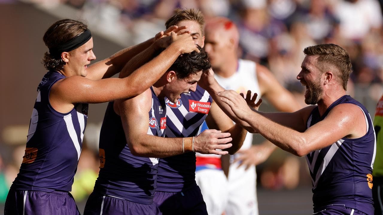 Fremantle players celebrating.