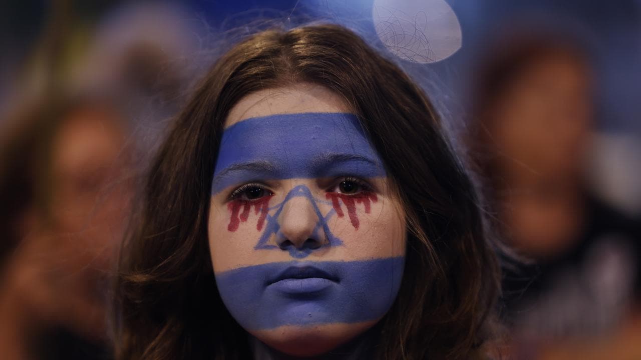 A protester wearing face paint