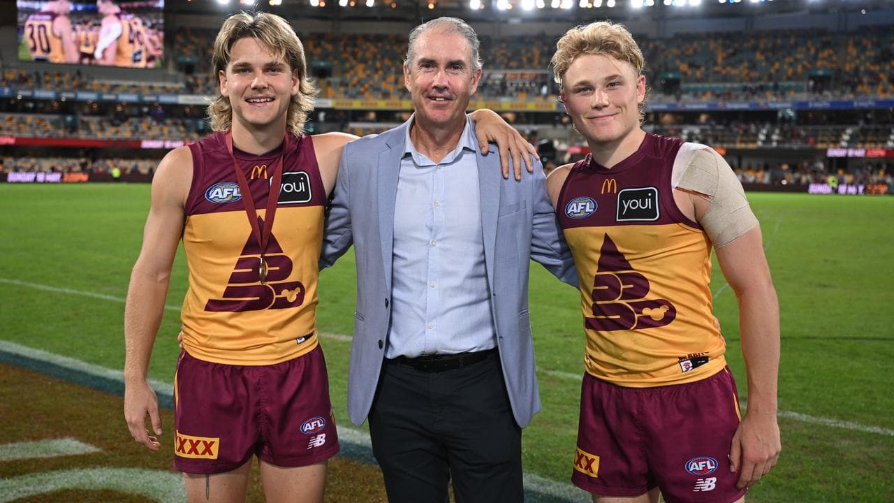 Will (left) and Levi Ashcroft catch up with their father, Marcus.