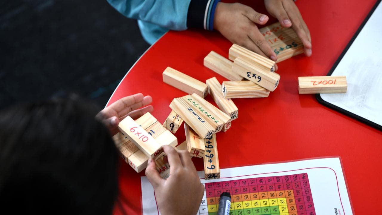 Students play with maths blocks