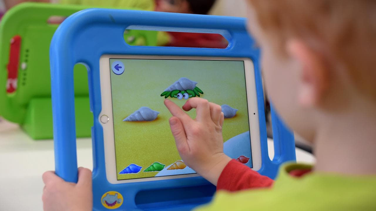 A child plays on an iPad (file image)