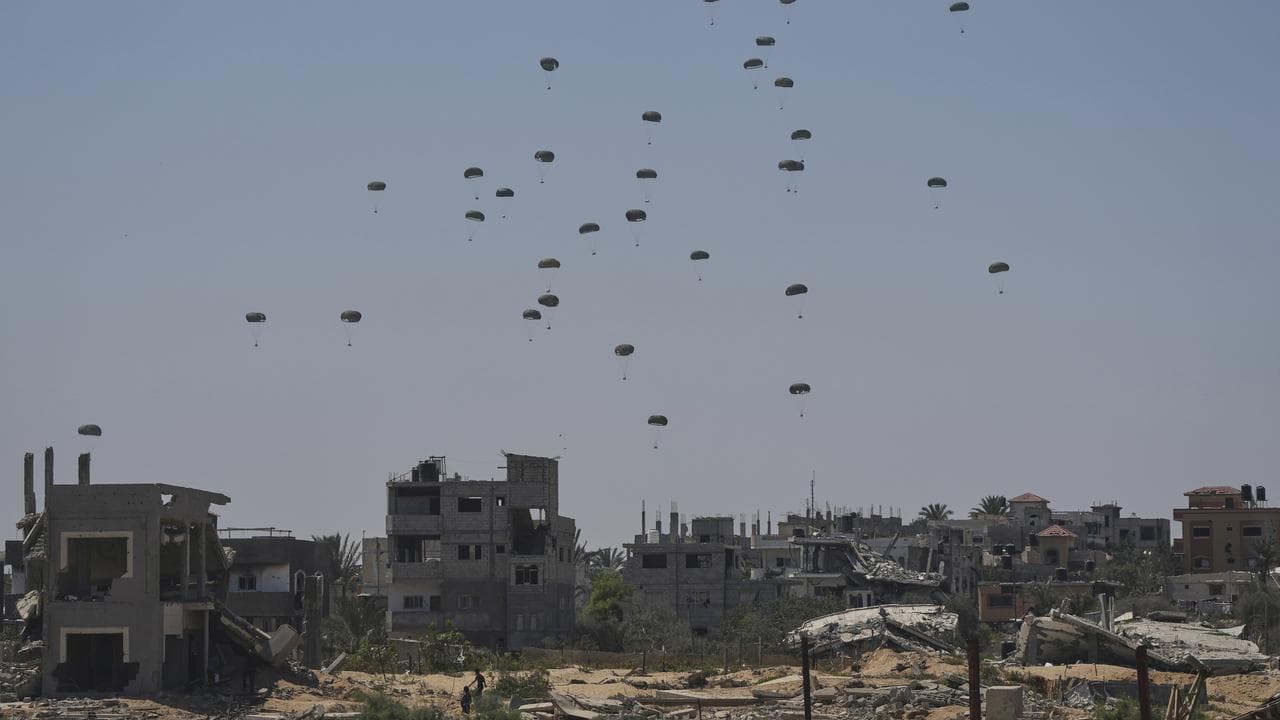 Parachutes drop supplies into Nuseirat, in the central Gaza Strip