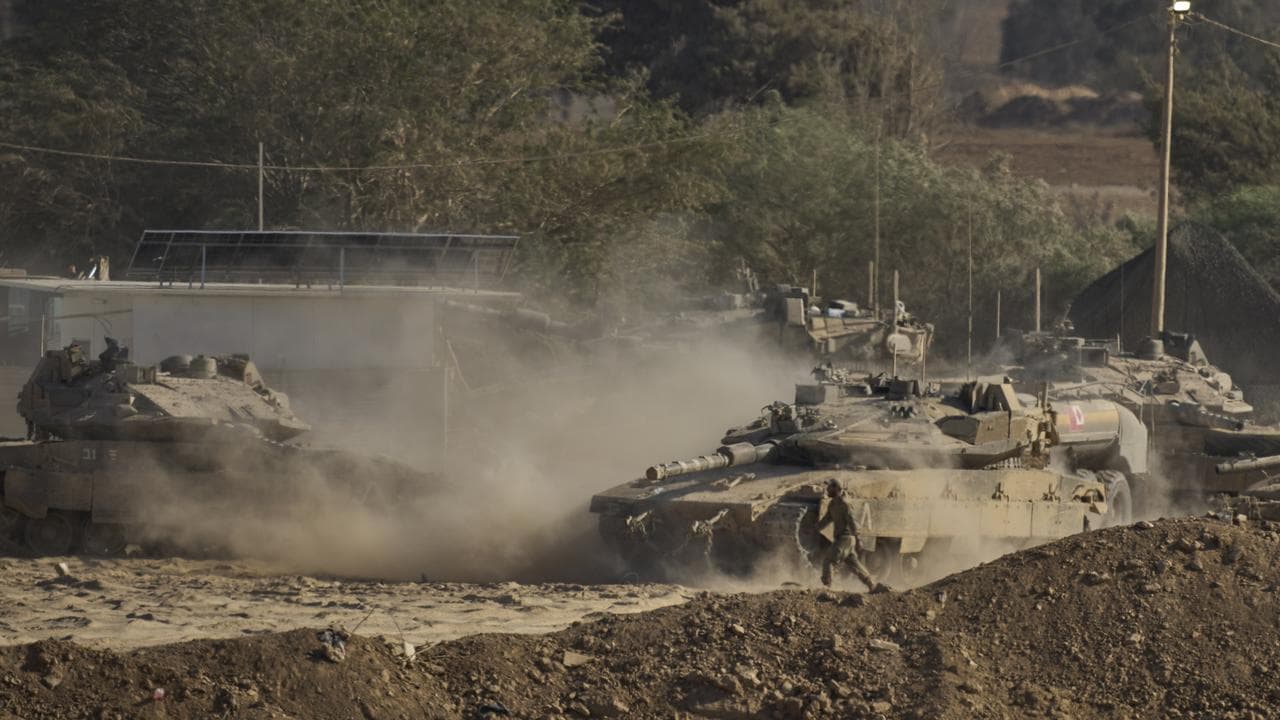 Israeli tanks move near the border of the Gaza Strip