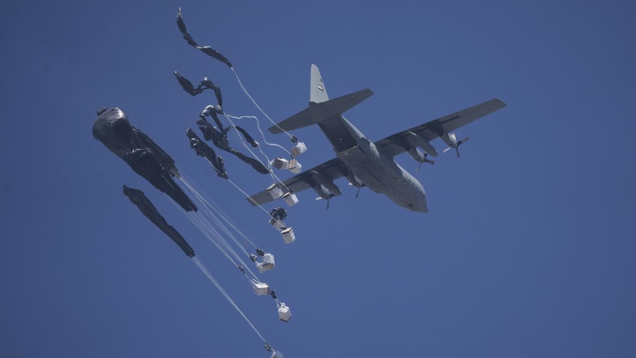 Humanitarian aid is airdropped to Palestinians over Gaza City