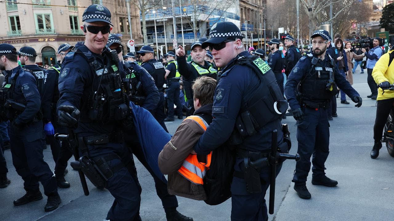 Police remove a pro-Palestine protester in Melbourne
