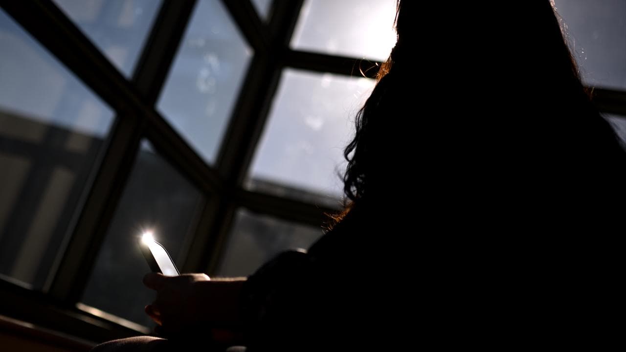 A woman on her mobile phone (file image)