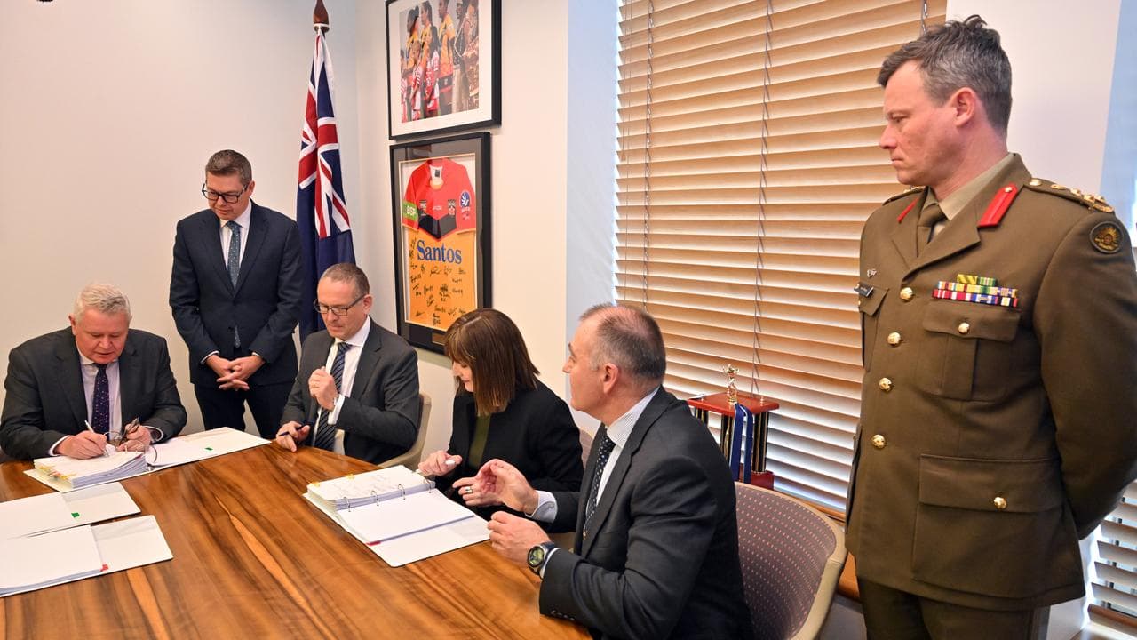 Defence Industry Minister Pat Conroy oversees the signing