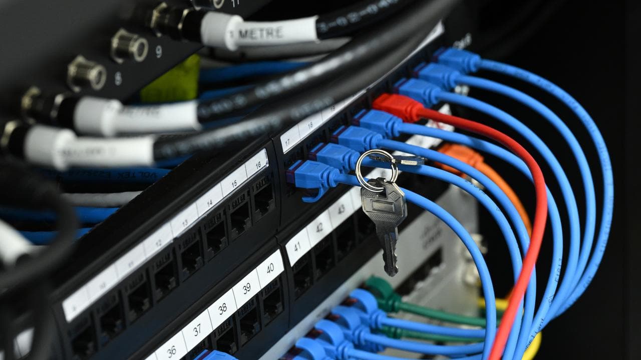 Stock image of a set of keys placed on ethernet cables
