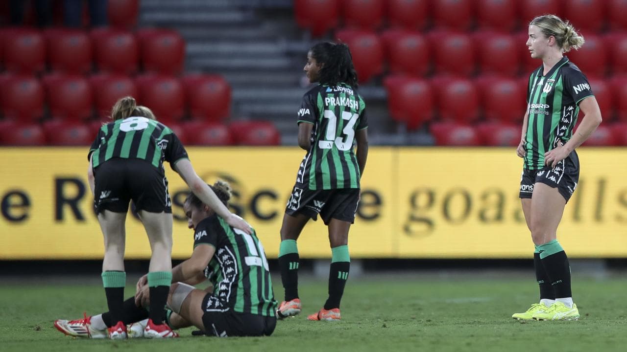 Disappointed Western United players.