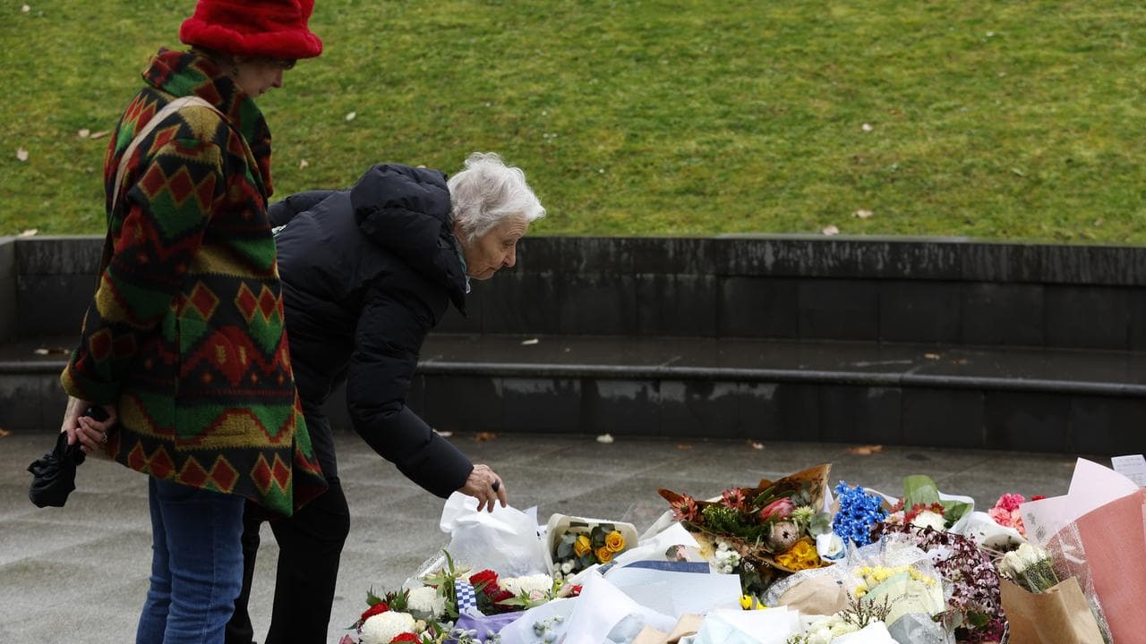Women lay floral tributes