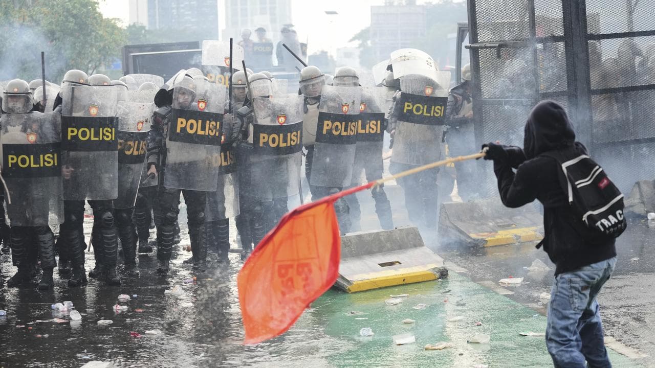 Protester confronts police in Jakarta