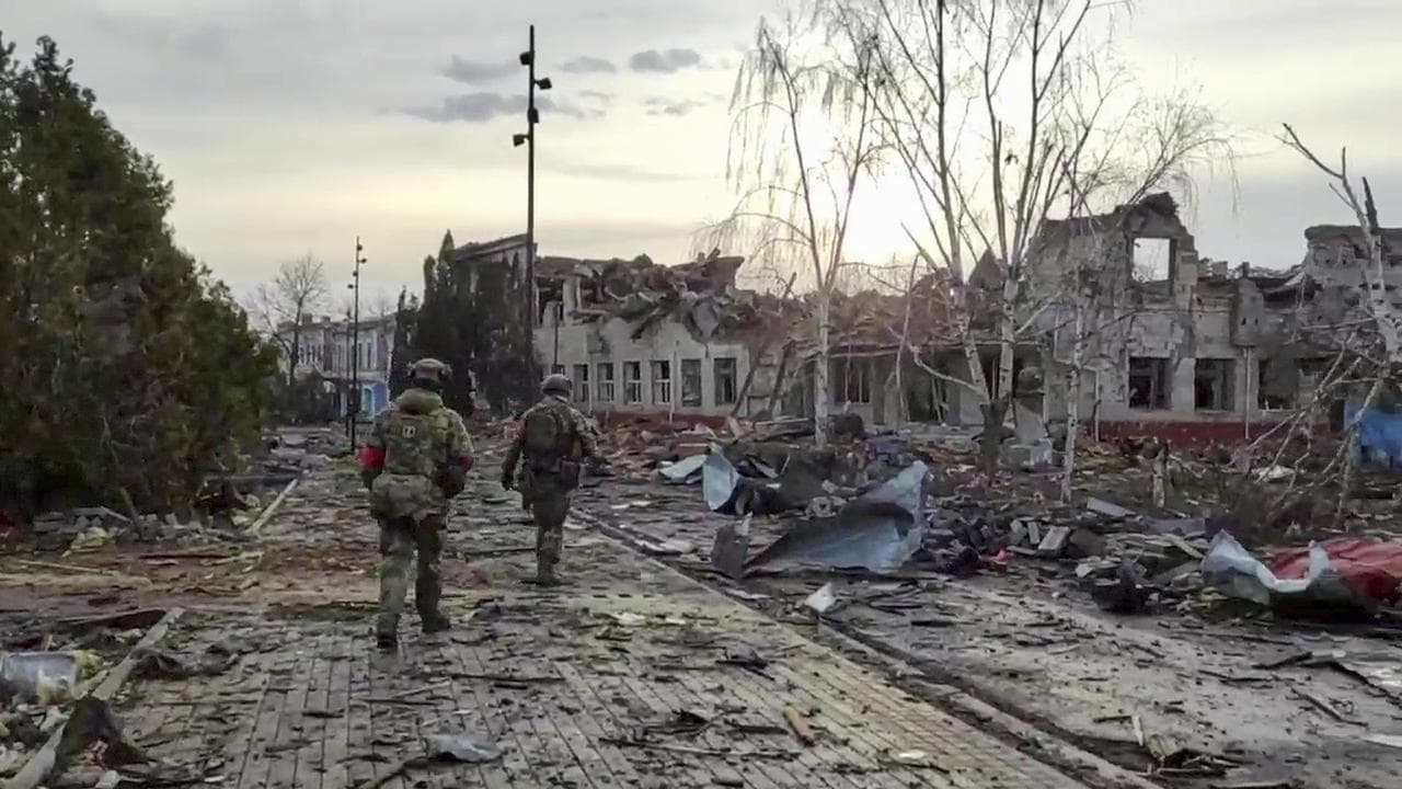 Russian soldiers patrol an area in Sudzha, in the Kursk region