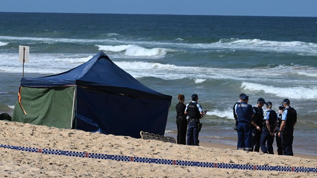 Police at the scene of a fatal shark attack at Long Reef Beach