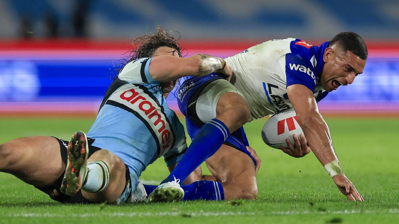 Nicho Hynes tackles Marcelo Montoya.