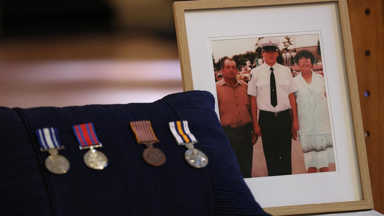 A photograph and medals on display