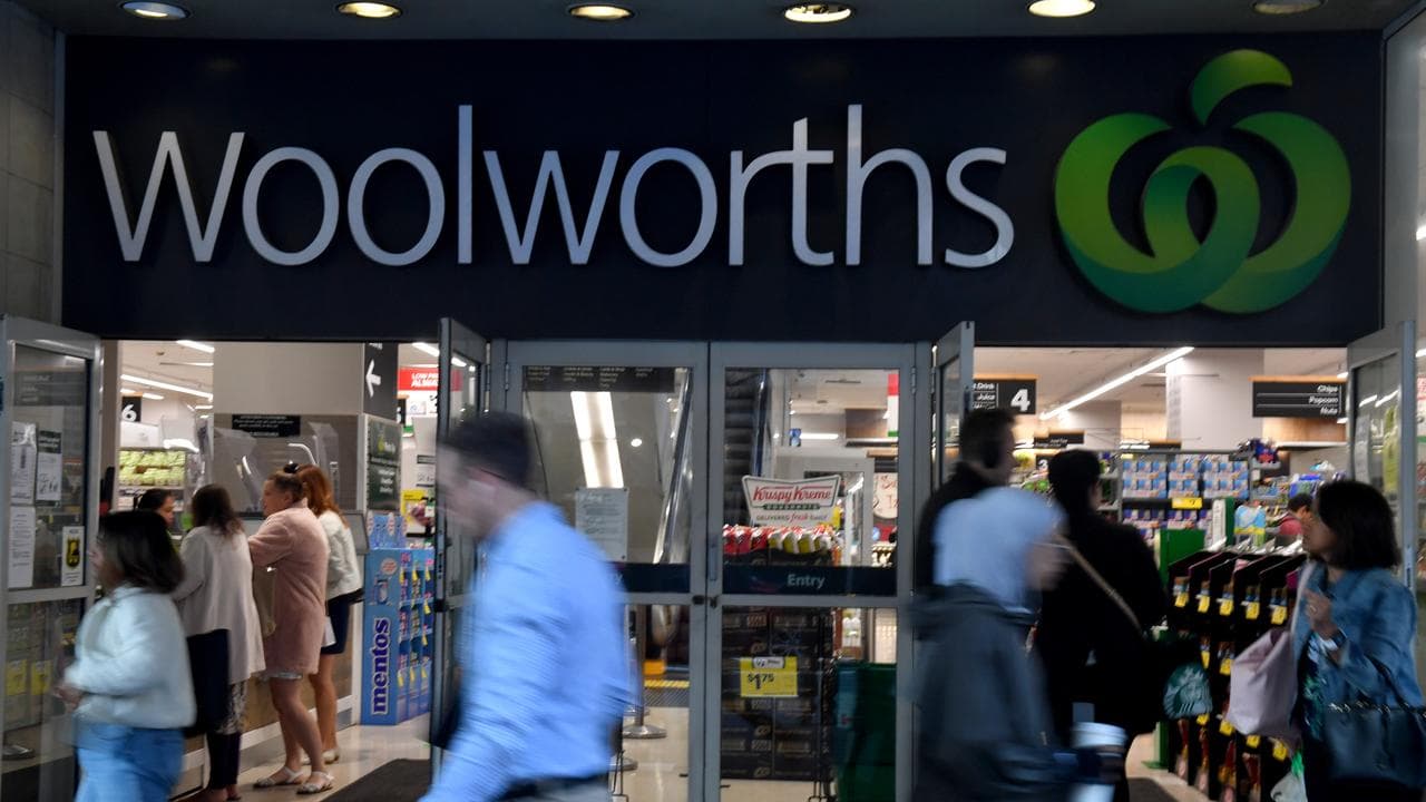 People walk past a Woolworths supermarket (file image)