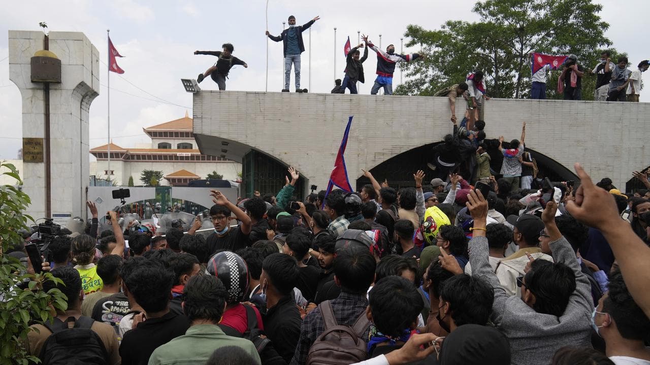 Protesters shout slogans outside parliament in Kathmandu, Nepal