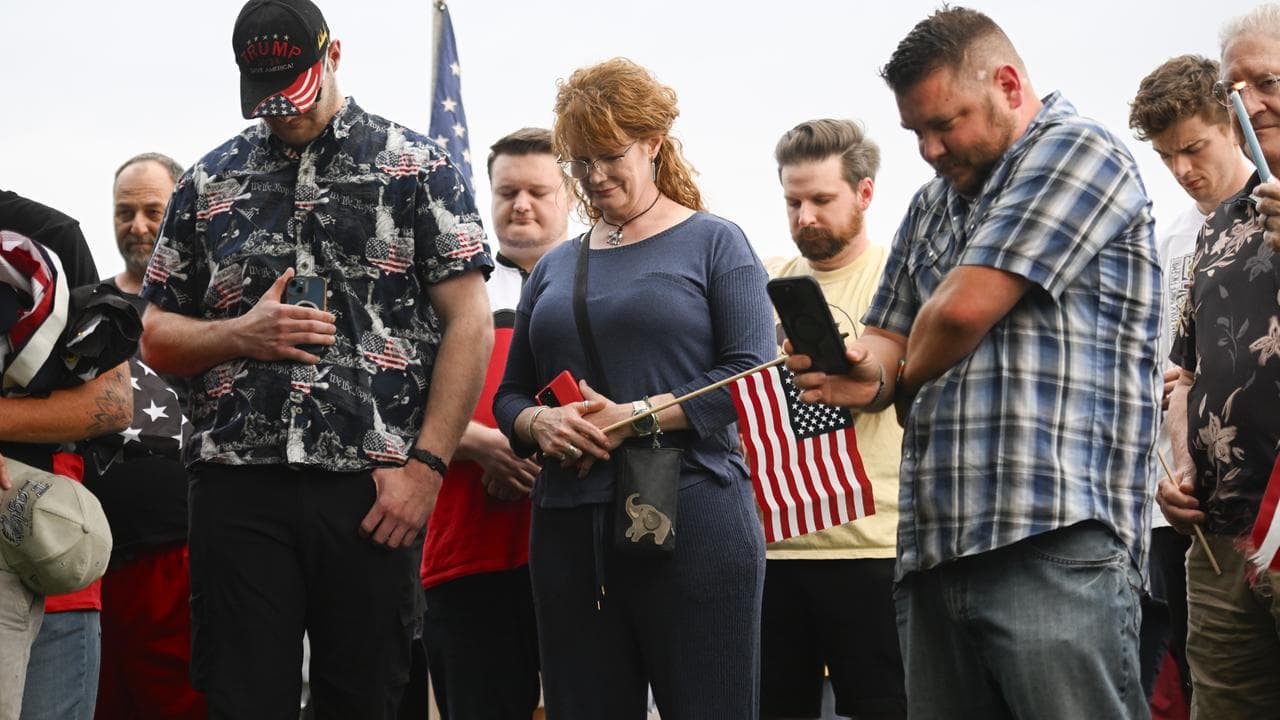 People at a vigil after the death of Charlie Kirk