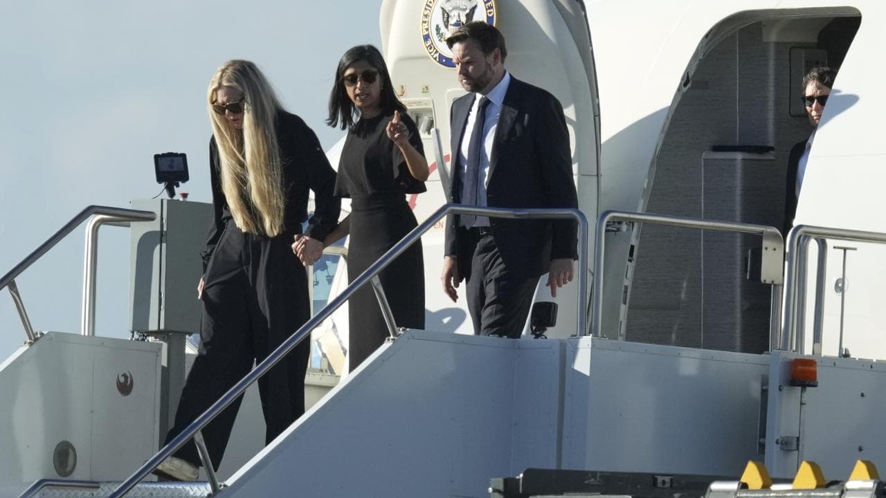 JD Vance and his wife Usha accompany Erika Kirk