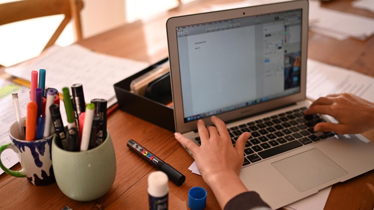 A student works on his laptop at home (file)