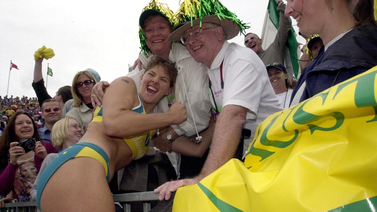 Natalie Cook hugs her mum and dad