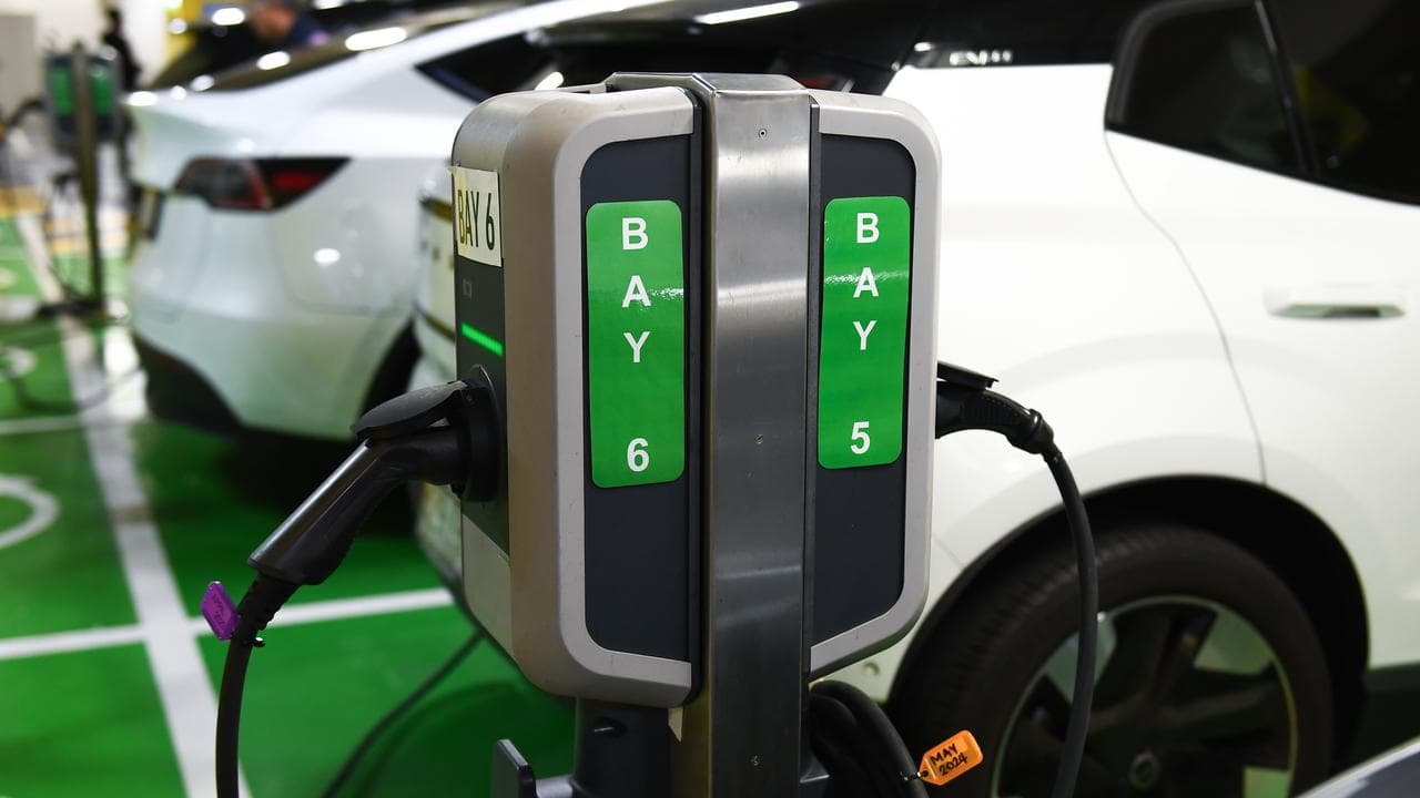 Electric vehicles being charged at a parking garage