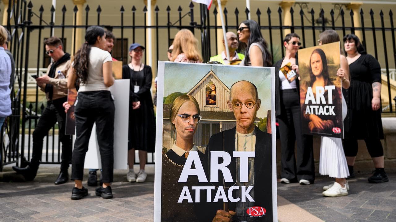 Art Gallery Of NSW (AGNSW) staff hold placards