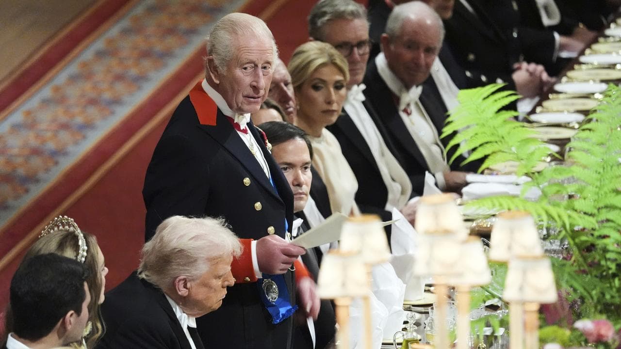 King Charles speaks next to President Donald Trump at a state banquet