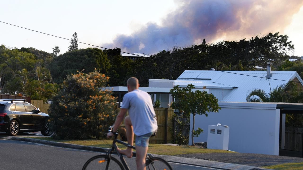 Smoke billows from a bushfire near Peregian Beach, Sunshine Coast