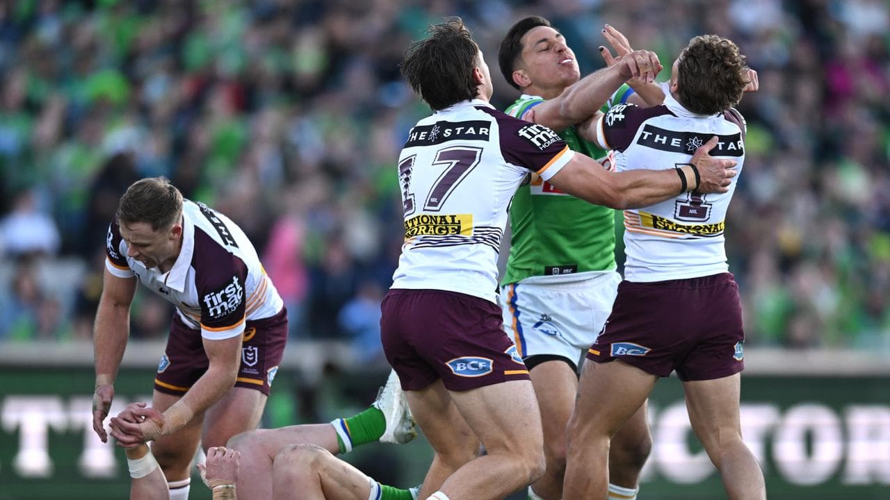 Fighting Canberra and Brisbane players.