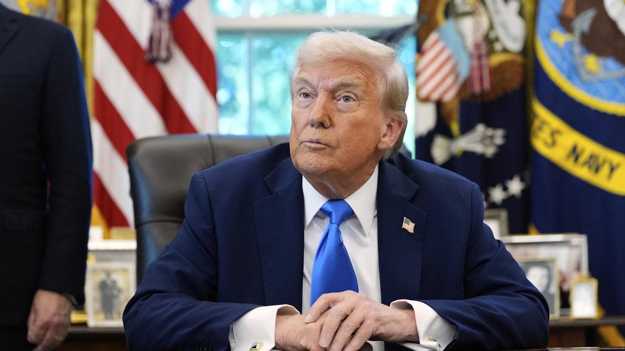 US President Donald Trump sits in the Oval Office