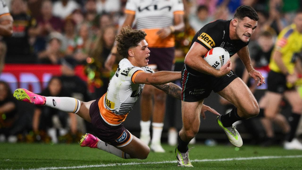 Nathan Cleary evades Brisbane's Reece Walsh to score