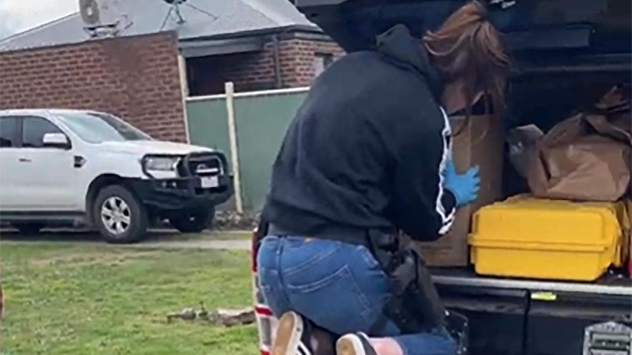 Police carrying evidence bags