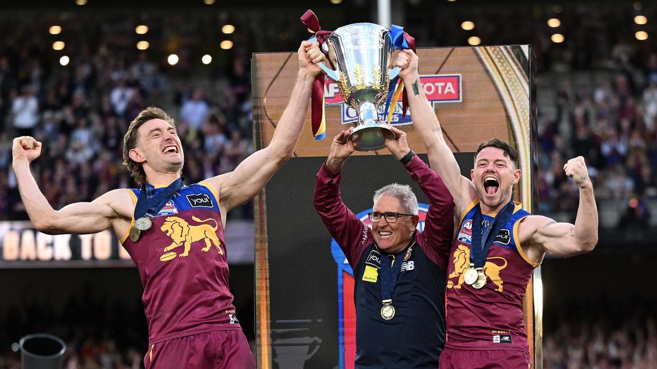 The Lions' Harris Andrews, coach Chris Fagan and Lachie Neale.