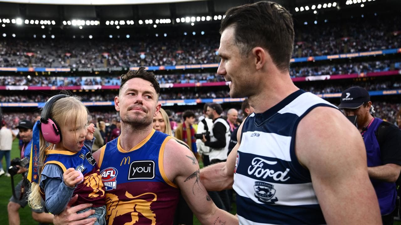Patrick Dangerfield congratulates Brisbane veteran Lachie Neale.