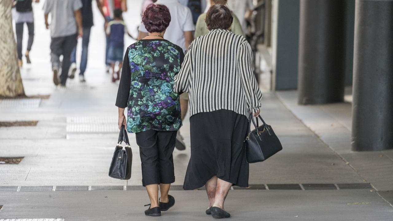 Elderly people walk in the street, in Brisbane