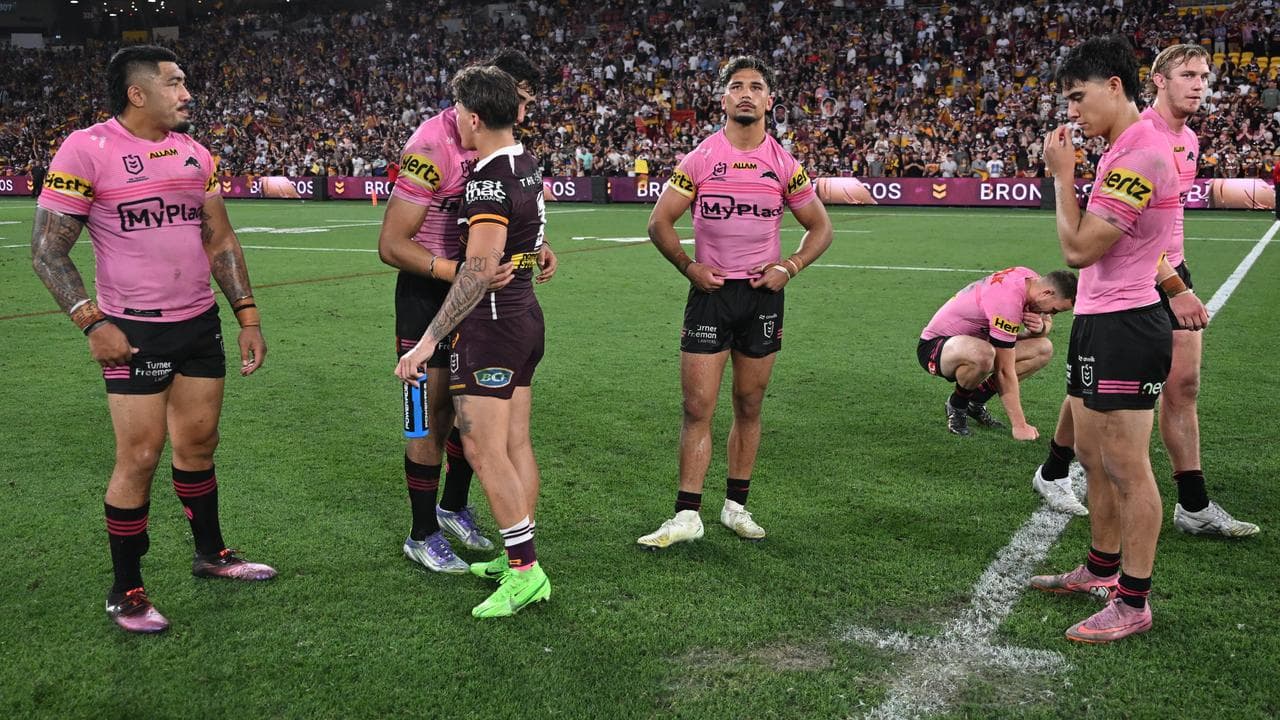 Brisbane's Reece Walsh talks with some of the Panthers