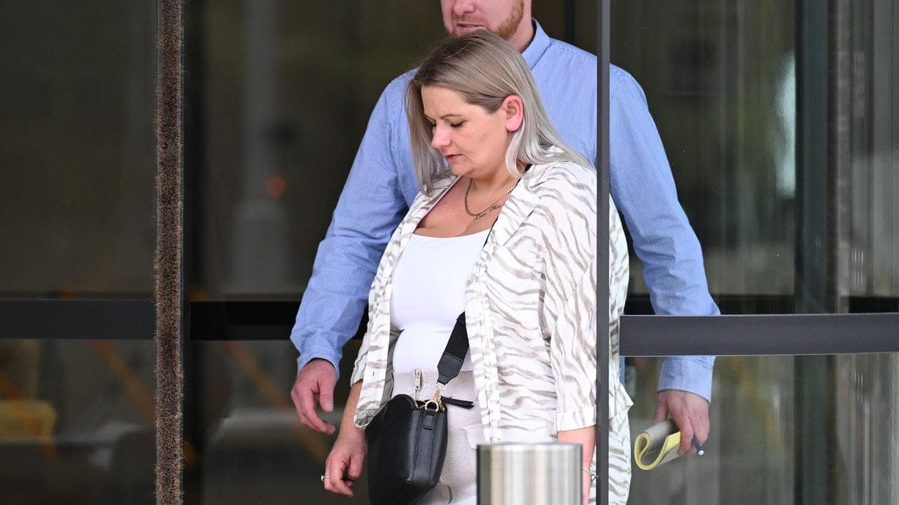 Shannon Merriman, daughter of Gregory Merriman, leaves the inquest