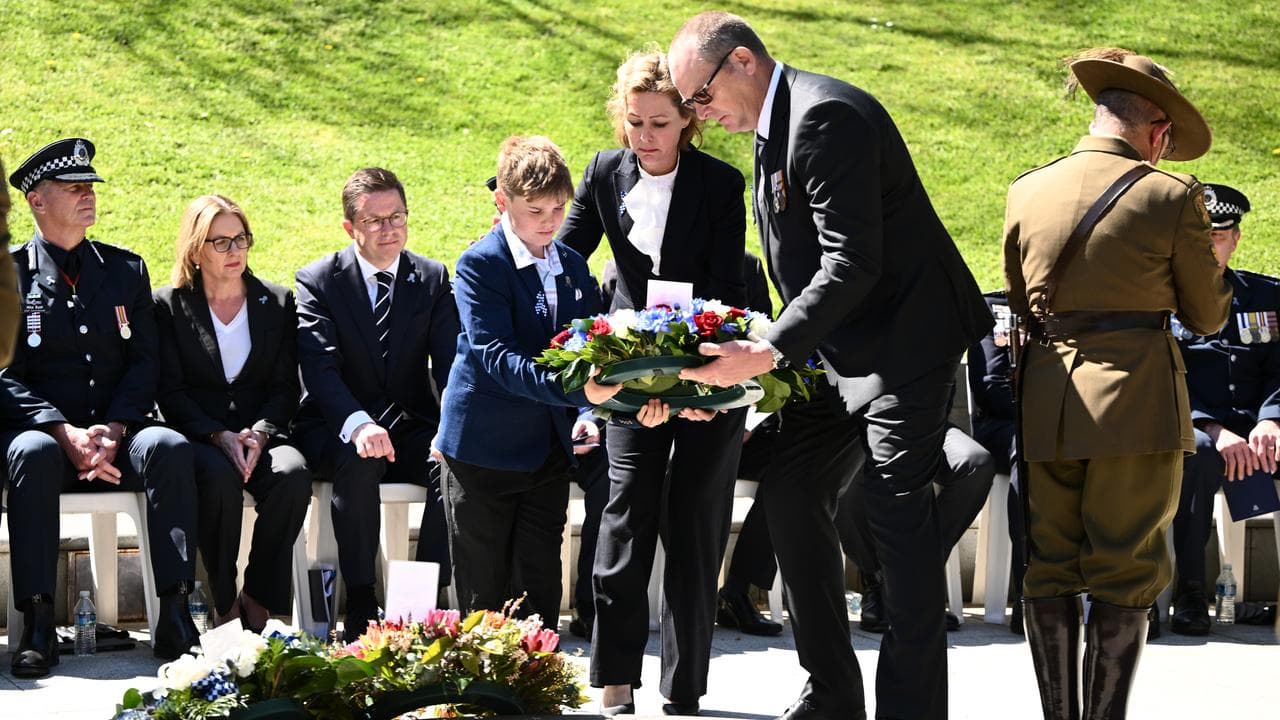 Sergeant Lisa Thompson lays a wreath