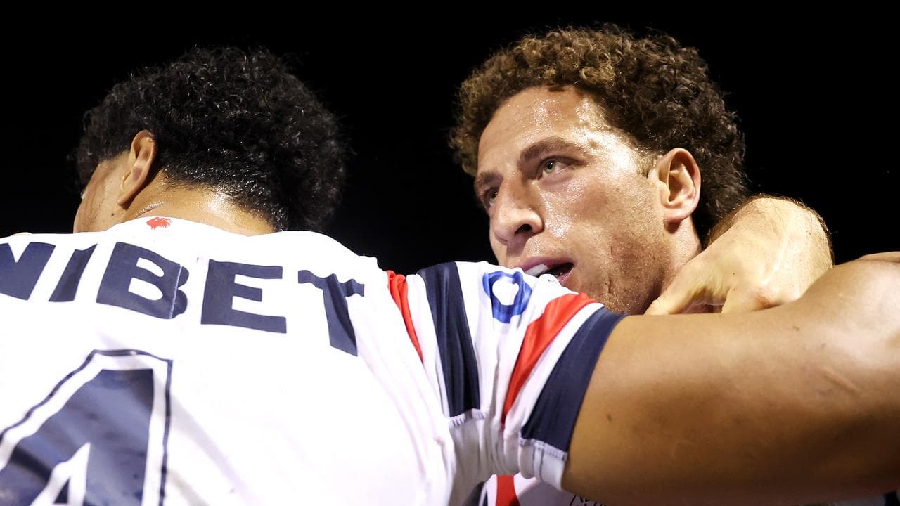 Robert Toia of the Roosters with Mark Nawaqanitawase of the Roosters