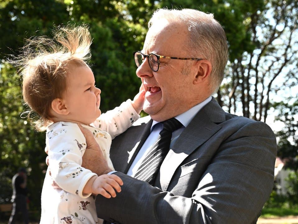 Prime Minister Anthony Albanese holds ten month old Savannah Clarke