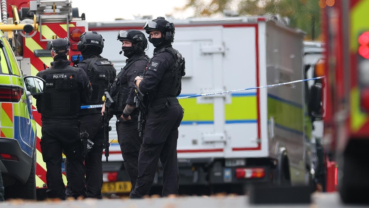 Armed police at a police cordon