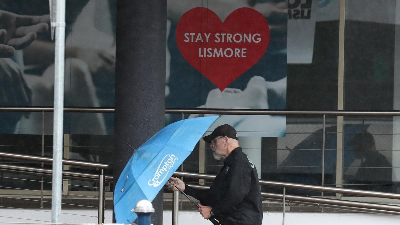 A man walks in the Lismore CBD