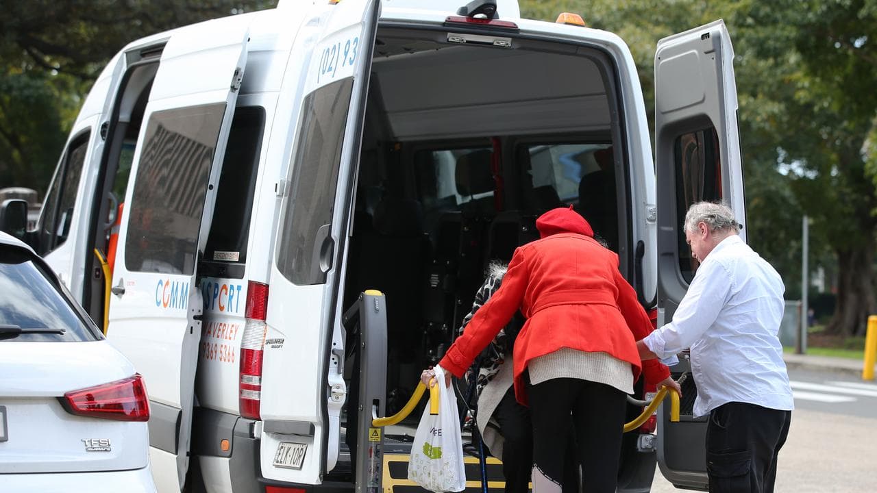 Elderly people use a hydraulic wheelchair platform