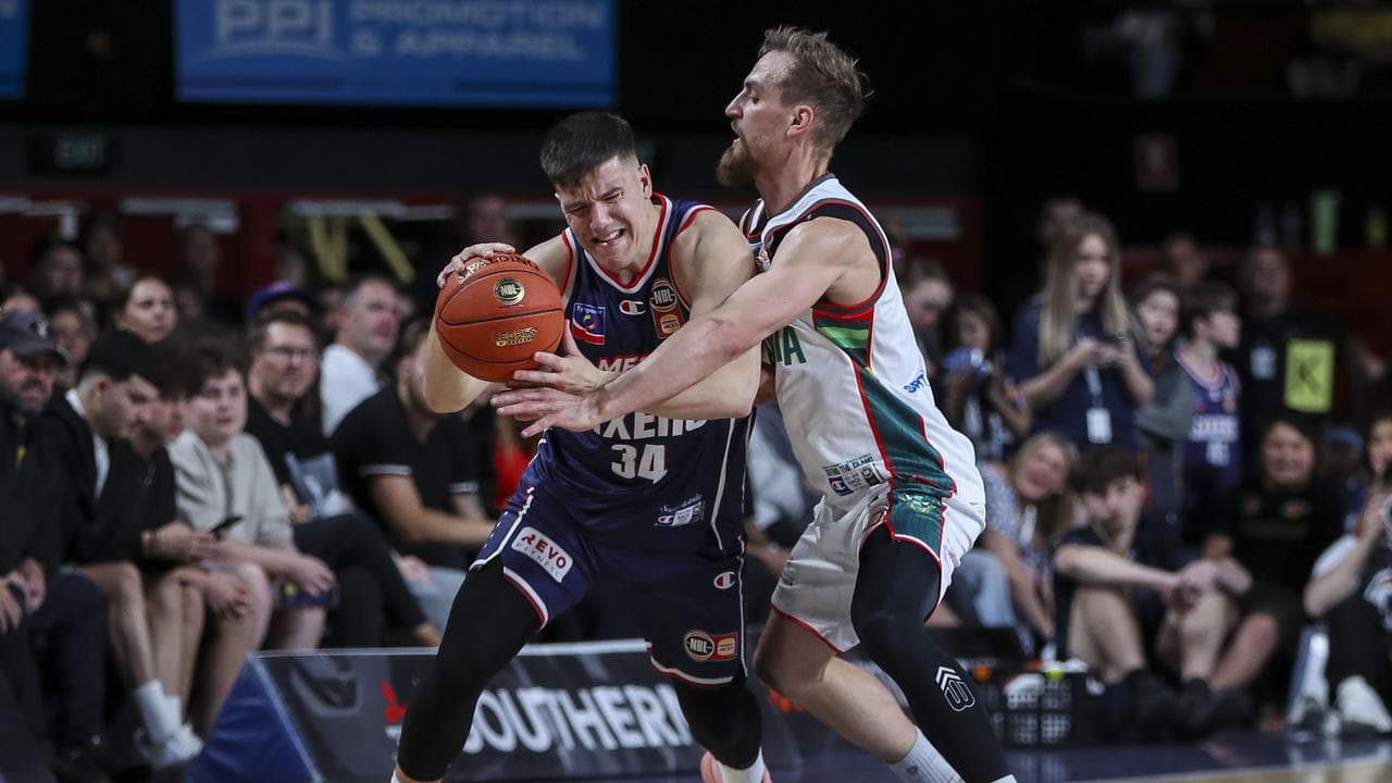 Dejan Vasiljevic and  Tasmania's Anthony Drmic.