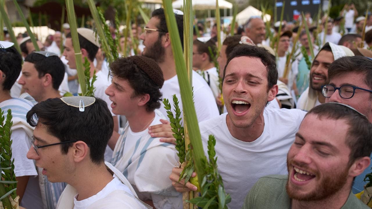 Israelis dance in the plaza known as hostages square in Tel Aviv