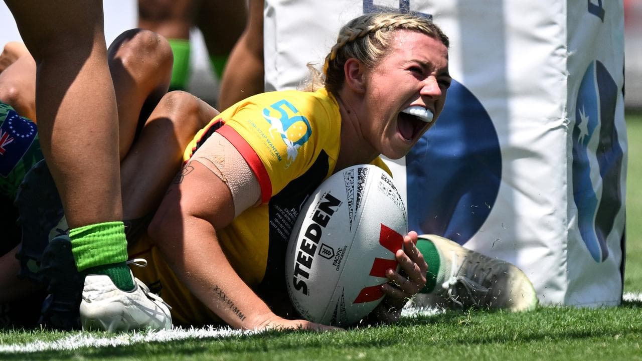 Emily Veivers scores a try for the PNG Orchids against Cook Islands.