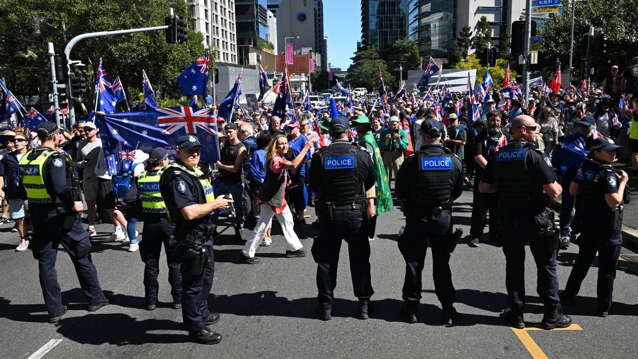 Police separating protesters for and against immigration, in Brisbane